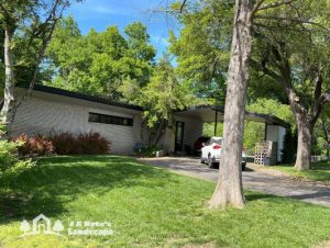 Norman home with a landscape and lawn care